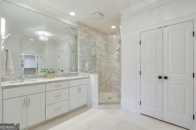 bathroom featuring vanity, tile patterned flooring, and a shower with door