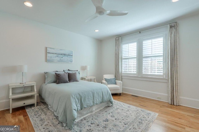 bedroom featuring light hardwood / wood-style floors and ceiling fan