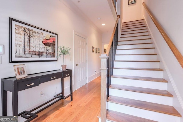 staircase featuring hardwood / wood-style flooring