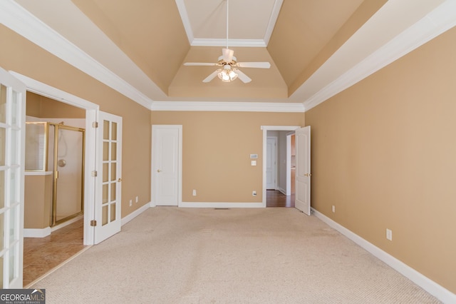 empty room featuring french doors, ceiling fan, high vaulted ceiling, and light carpet