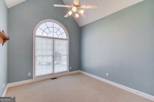 carpeted empty room featuring lofted ceiling and ceiling fan