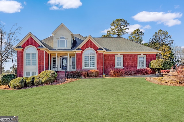 view of front of home with a front lawn and covered porch