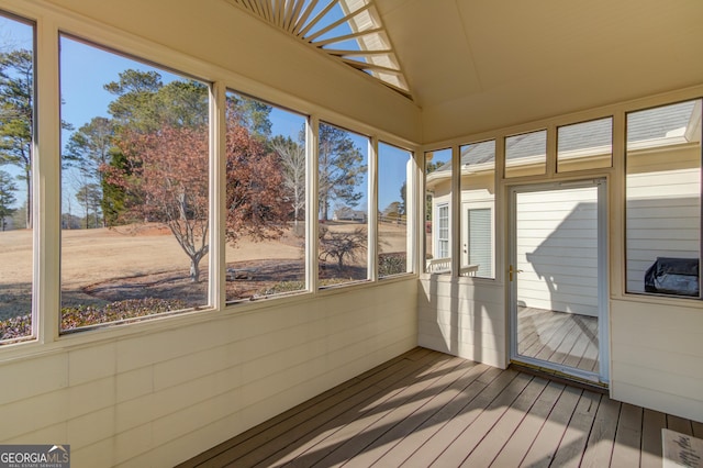 unfurnished sunroom featuring lofted ceiling