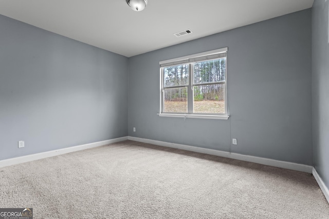 spare room featuring carpet flooring