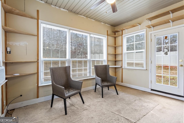 sitting room featuring a healthy amount of sunlight, light colored carpet, and ceiling fan