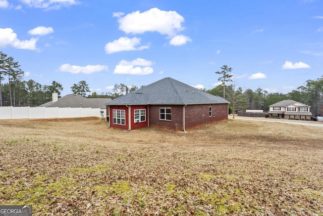 back of house with a yard