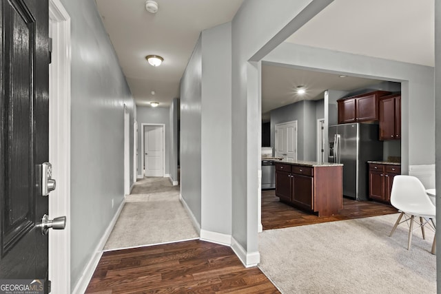 hall with dark hardwood / wood-style flooring