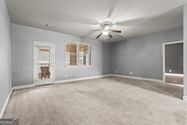 carpeted empty room with ceiling fan