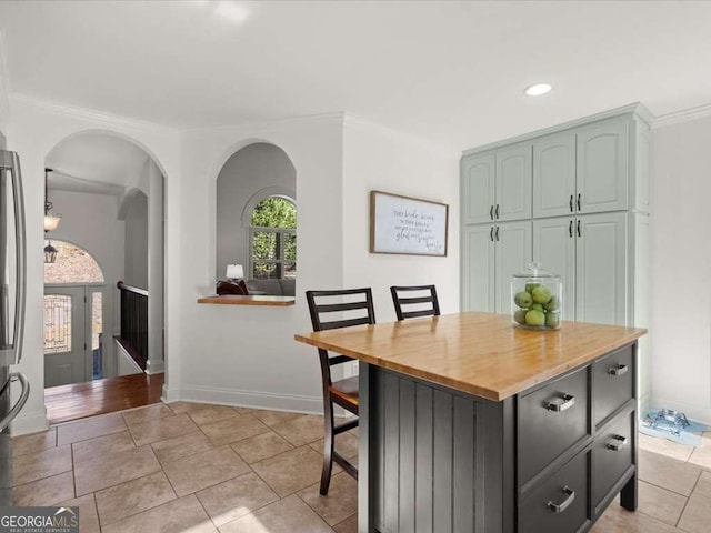 dining area featuring light tile patterned flooring