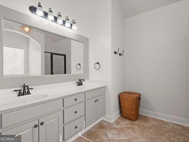 bathroom featuring tile patterned floors and vanity