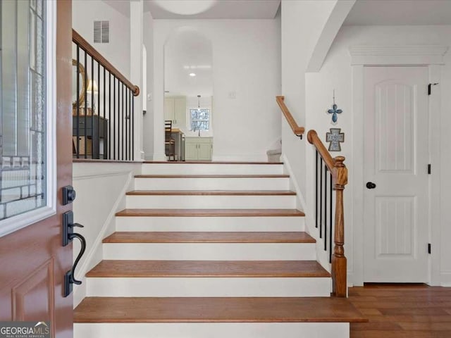 stairway with wood-type flooring