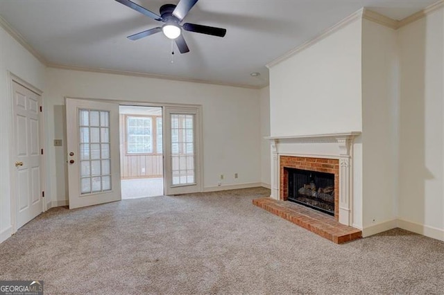 unfurnished living room with ornamental molding, carpet floors, and a brick fireplace