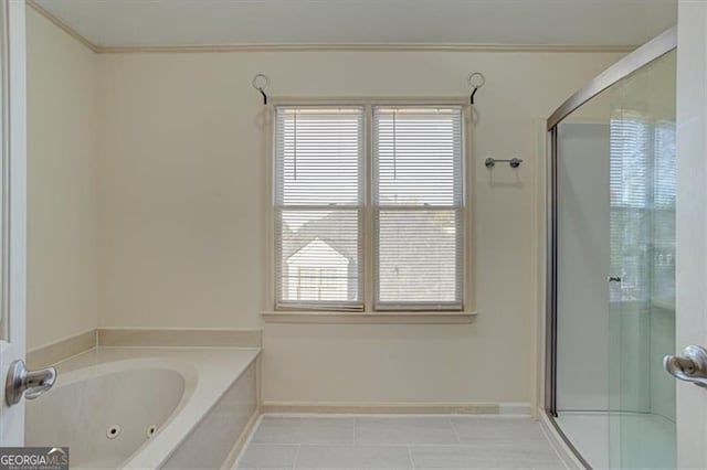 bathroom with tile patterned flooring and separate shower and tub