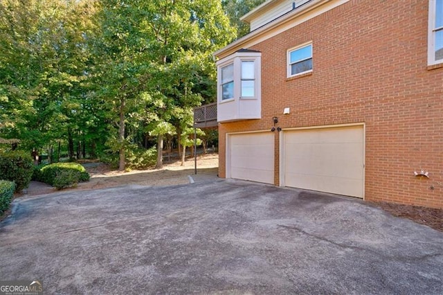 view of side of property featuring a garage