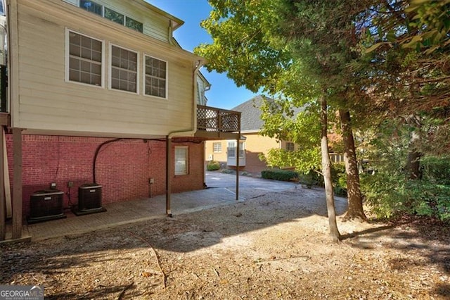 exterior space with a patio and central air condition unit