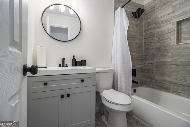 full bathroom featuring vanity, shower / tub combo, and toilet