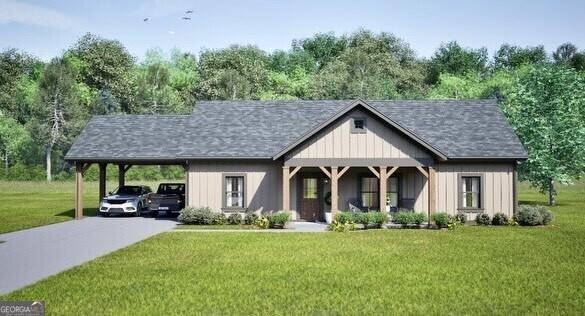 view of front facade featuring a carport and a front lawn