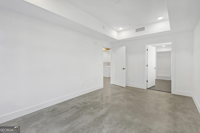 spare room with concrete flooring