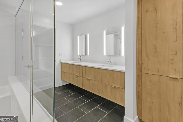 bathroom with tile patterned floors, a shower with shower door, and vanity