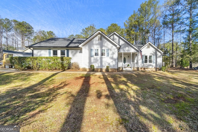 ranch-style house with covered porch and a front yard