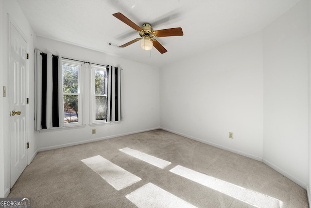 carpeted empty room with ceiling fan