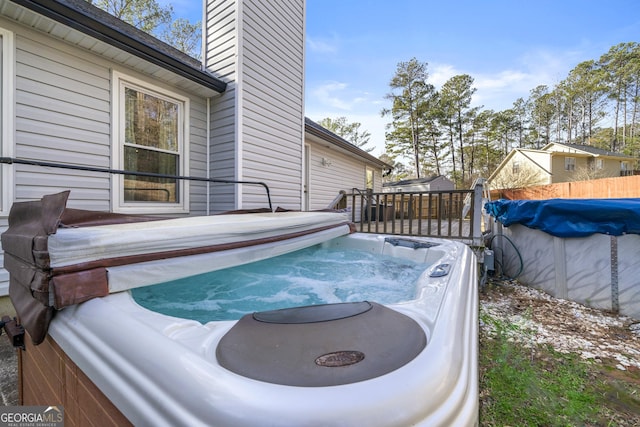 view of pool featuring a hot tub