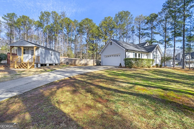 view of property exterior featuring a garage and a lawn