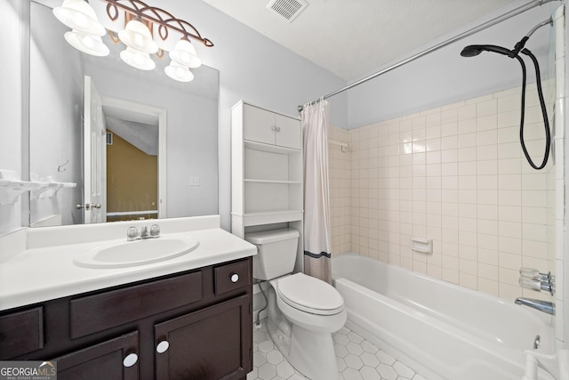 full bathroom with shower / tub combo with curtain, tile patterned flooring, vanity, a textured ceiling, and toilet