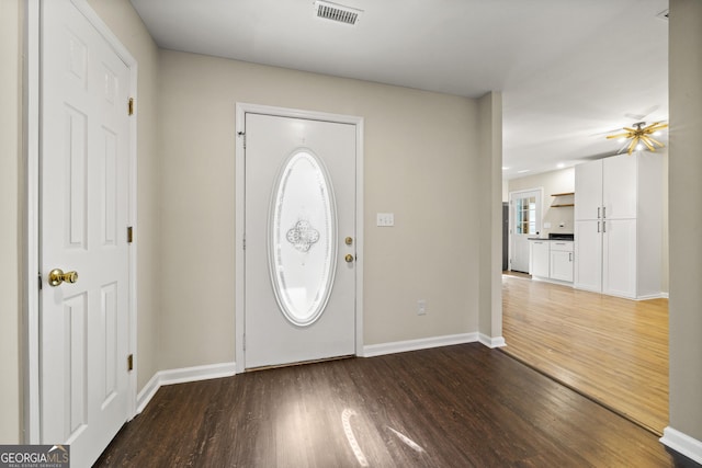 foyer with dark wood-type flooring