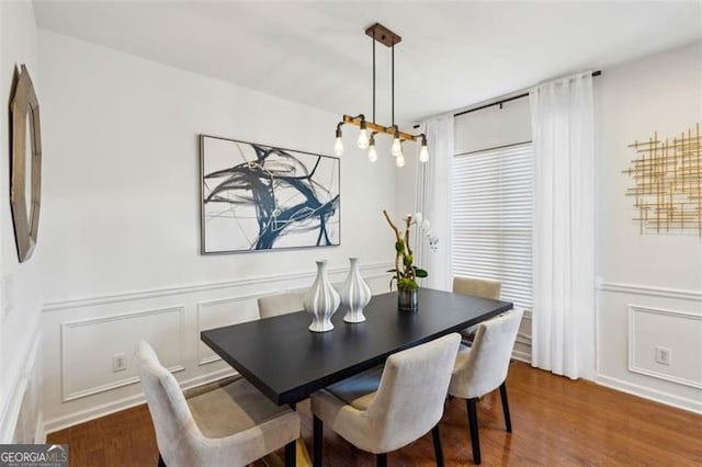 dining space with dark hardwood / wood-style floors