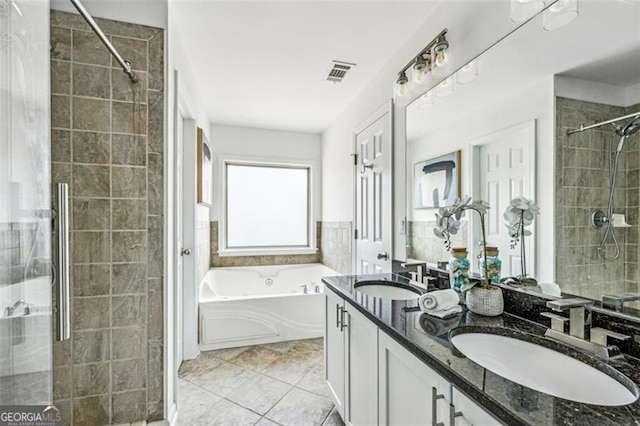 bathroom with vanity, plus walk in shower, and tile patterned flooring