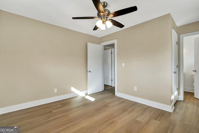 unfurnished bedroom featuring ceiling fan and light hardwood / wood-style flooring