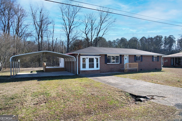 view of front of house with a front yard and a carport