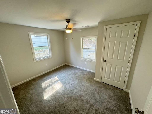 unfurnished bedroom with carpet and ceiling fan