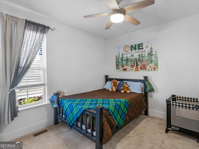 carpeted bedroom with ceiling fan