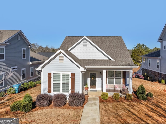 view of front of property with covered porch and a front yard