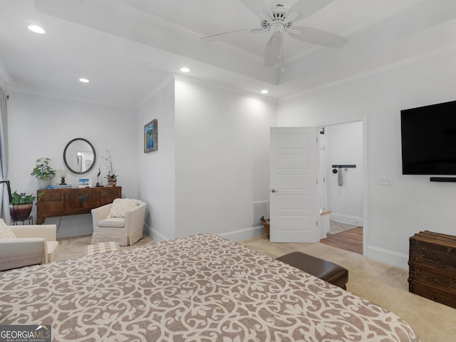 bedroom featuring crown molding, light colored carpet, and ceiling fan