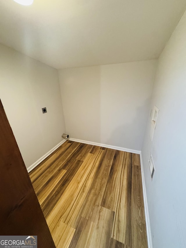 washroom featuring hookup for a washing machine, wood-type flooring, and hookup for an electric dryer