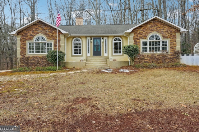 single story home with a front yard