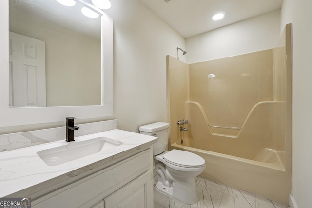 full bathroom featuring shower / washtub combination, vanity, and toilet