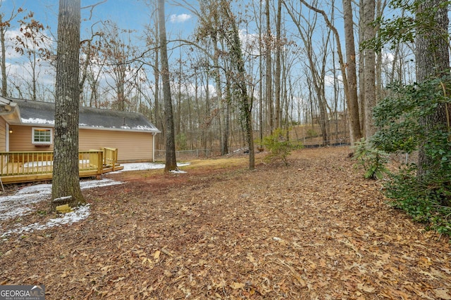 view of yard with a wooden deck