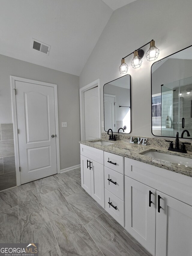 bathroom featuring lofted ceiling and independent shower and bath