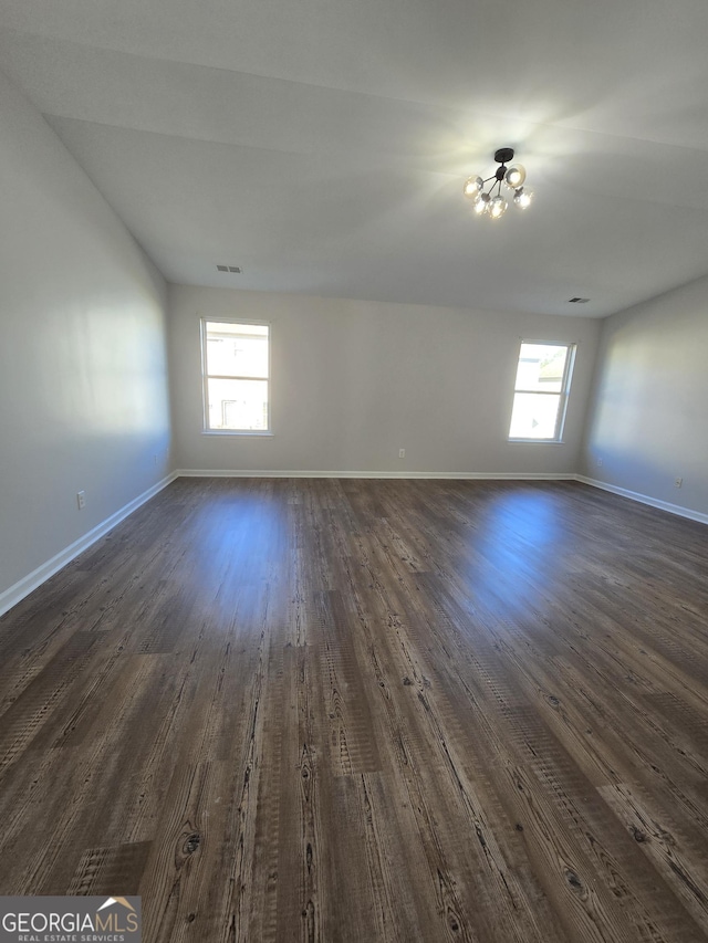 empty room with dark hardwood / wood-style floors