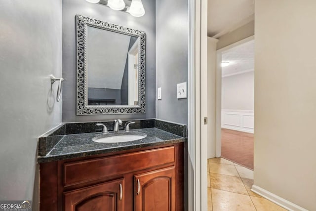 bathroom with tile patterned flooring and vanity