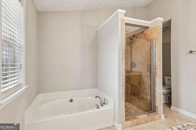 bathroom featuring tile patterned floors, shower with separate bathtub, and toilet