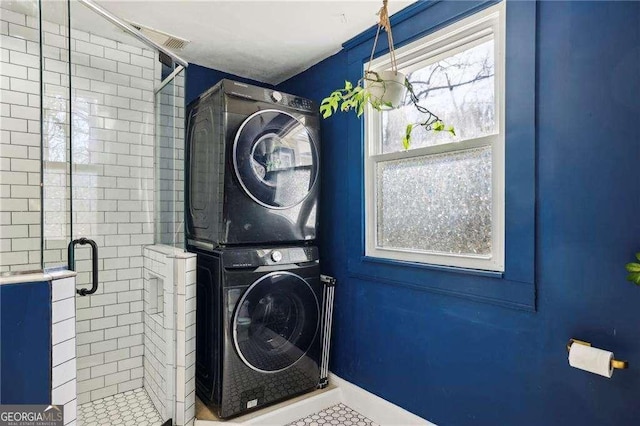 laundry room featuring stacked washing maching and dryer