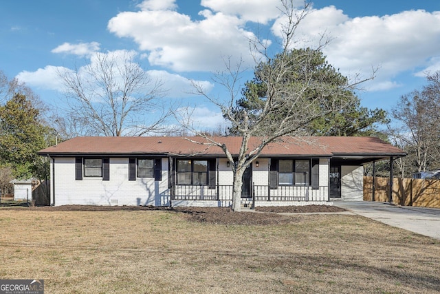 single story home featuring a carport and a front lawn