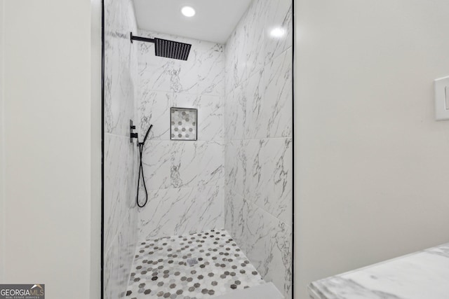 bathroom featuring a tile shower