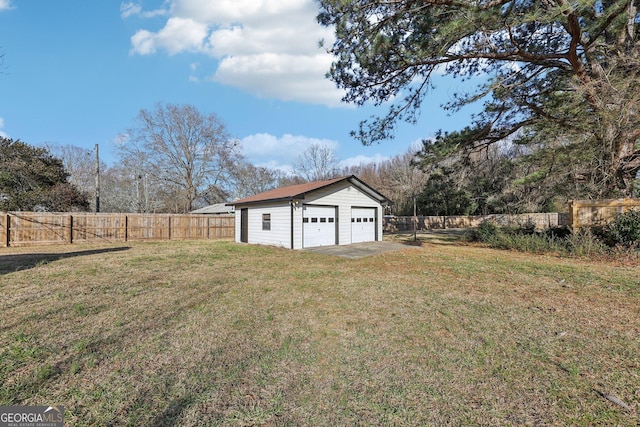 view of yard featuring an outbuilding and a garage