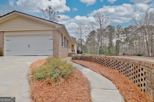 view of property exterior with a garage